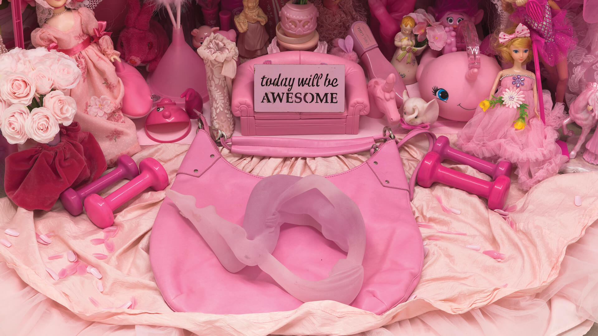 Today Will be Awesome, 2021, found pink objects, pink synthetic fabric & cloths, mannequin, salvaged round bar table and a deconstructed secretary desk/cabinet, Portia Munson
